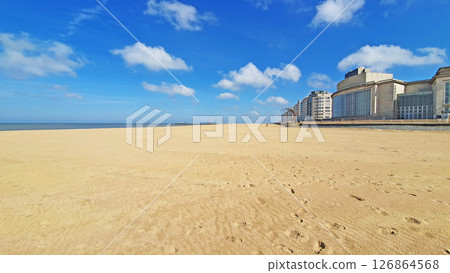 Walking way on the beach. much sand, water and sky near the hotels. Ostende, Belguim Walking way on the beach. much sand, water and sky near the hotels. Ostende, Belguim 126864568