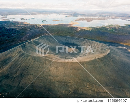 Breathtaking aerial view of a volcanic crater in Iceland showcasing its unique geological features and surrounding landscape 126864607