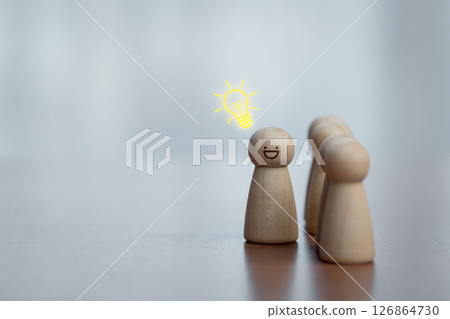Wooden Figures with Bright Idea Symbol, Representing Creativity and Leadership Wooden Figures with Bright Idea Symbol, Representing Creativity and Leadership 126864730