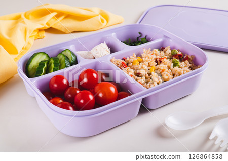 Homemade lunchbox with meat, vegetables and cereals for lunch at work on the table 126864858