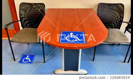 An Inclusive Meeting Space Featuring Wheelchair Symbols for Enhanced Accessibility and Comfort An Inclusive Meeting Space Featuring Wheelchair Symbols for Enhanced Accessibility and Comfort 126865654