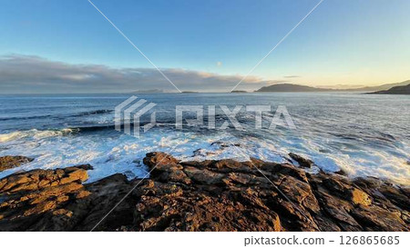 A Serene Coastal Scene Captured at Sunrise with Stunning Views and Beautiful Aesthetic 126865685
