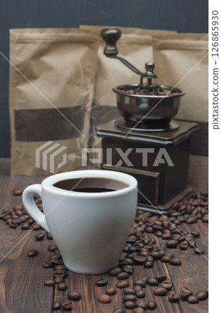 Coffee beans, mill, ground coffee on wooden table. Copyspace. Making coffee 126865930