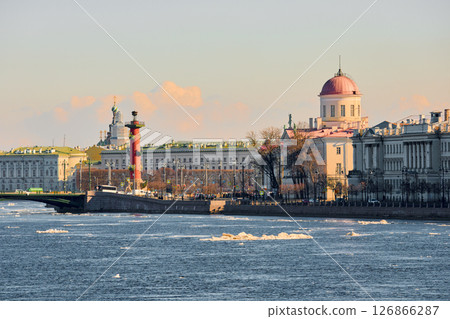 ice drift on the Neva River with a view of the arrow of Vasilyevsky Island with rostral columns, the Winter Palace, St. Isaac's Cathedral, the Savior on Spilled Blood 126866287
