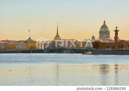 ice drift on the Neva River with a view of the arrow of Vasilyevsky Island with rostral columns, the Winter Palace, St. Isaac's Cathedral, the Savior on Spilled Blood 126866290