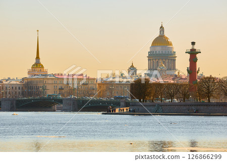 ice drift on the Neva River with a view of the arrow of Vasilyevsky Island with rostral columns, the Winter Palace, St. Isaac's Cathedral, the Savior on Spilled Blood 126866299