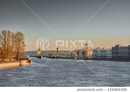 ice drift on the Neva River with a view of the arrow of Vasilyevsky Island with rostral columns, the Winter Palace, St. Isaac's Cathedral, the Savior on Spilled Blood 126866306