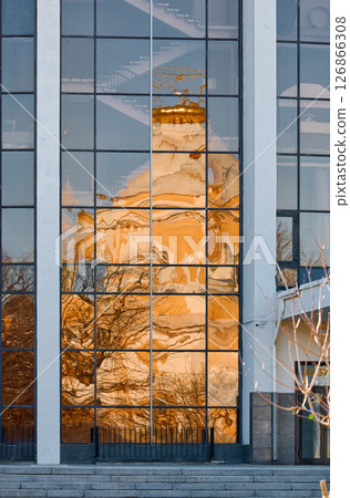 reflection of the Prince Vladimir Cathedral on the glass facade of the building in springtime 126866308