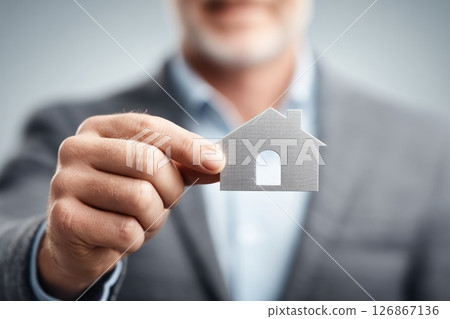 Real Estate Agent Holding House Icon 126867136