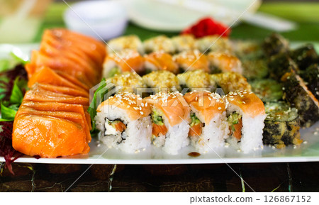 sushi set of fresh salmon, philadelphia springroll, salmon slices sushi set of fresh salmon, philadelphia springroll, salmon slices 126867152