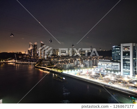 Aerial view of Singapore harbor skyscrapers and cable cars at night 126867177