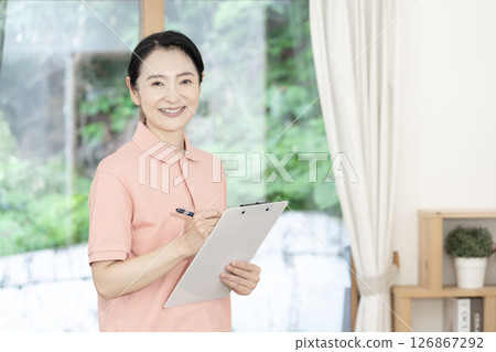 Middle-aged female caregiver/care worker 126867292