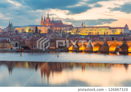 Vltava River and historic Prague at sunset in Prague Czech Republic 126867328