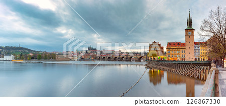 Vltava River and historic Prague at sunset in Prague Czech Republic 126867330