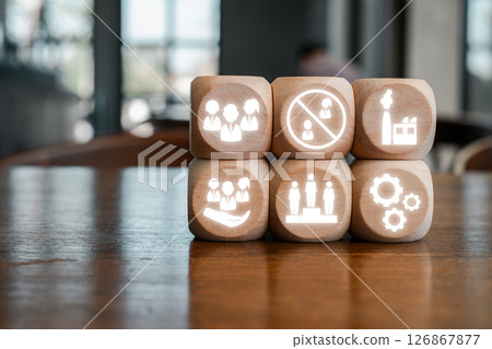 Wooden blocks with icons illustrating the 3Cs model: customers, competitors, and corporation, on a wooden table. 126867877