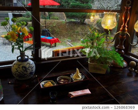 Spring in Akita Prefecture: A Japanese-style cafe inside Kinpo Shrine. View from inside Kinpo Garden. Spring in Akita Prefecture: A Japanese-style cafe inside Kinpo Shrine. View from inside Kinpo Garden. 126868369