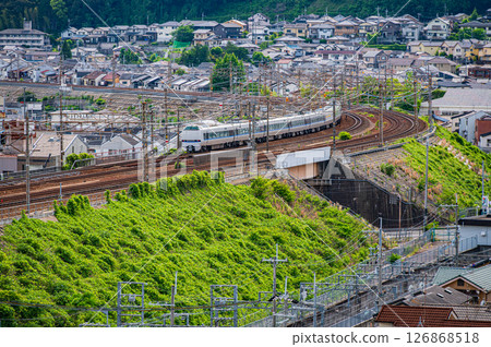 A limited express train running between Yamashina and Kyoto on the Tokaido Main Line. View from the Yamashina Observation Plaza. 126868518