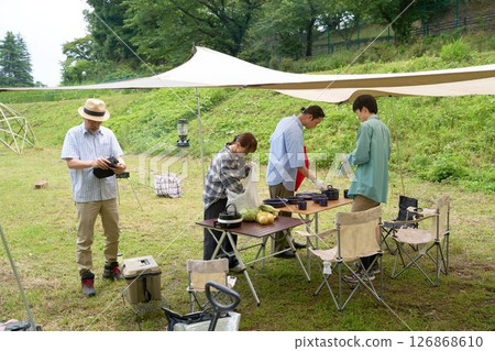 Camping friends preparing for a barbecue 126868610