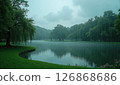 A park with a large pond on a rainy day 126868686