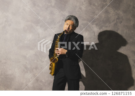 man blowing sax 126871155