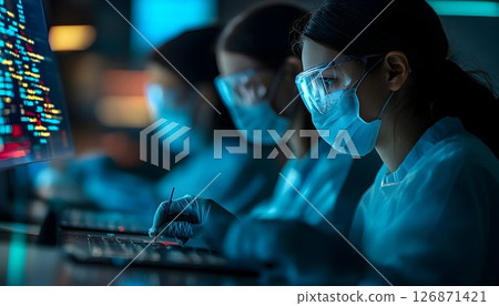 Focused Laboratory Team Working Late Night on a Project 126871421