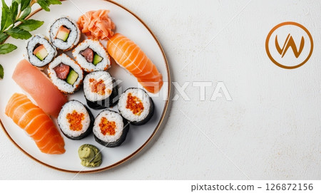 Elegant Dinner Concept with Sushi Platter Featuring Fresh Salmon and Rolls on a White Plate 126872156