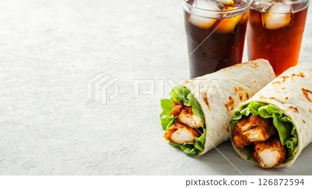 Delicious Chicken Wraps and Refreshing Iced Drinks on a Lunch Break - Perfect for a Quick and Tasty Meal Delicious Chicken Wraps and Refreshing Iced Drinks on a Lunch Break - Perfect for a Quick and Tasty Meal 126872594