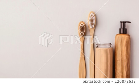 Eco-Friendly Zero Waste Bathroom Essentials with Bamboo Toothbrushes and Reusable Containers on Minimalist Background Eco-Friendly Zero Waste Bathroom Essentials with Bamboo Toothbrushes and Reusable Containers on Minimalist Background 126872632