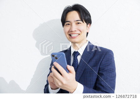 Businessmen using smartphones 126872718