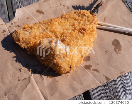 Golden horse mackerel from Chiba Prefecture. Large fried horse mackerel eaten outdoors. Golden horse mackerel from Chiba Prefecture. Large fried horse mackerel eaten outdoors. 126874650