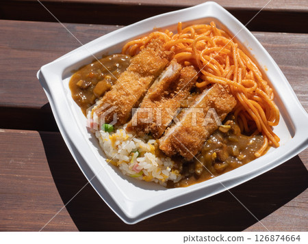 A bento packed with side dishes. Fried rice, curry, pork cutlet, and Neapolitan. A bento packed with side dishes. Fried rice, curry, pork cutlet, and Neapolitan. 126874664