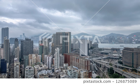 June 1 2025 Urban Skyline with Residential Tower and Highway 126875089
