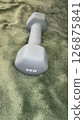 2kg dumbbell and green fabric texture 126875841