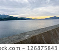 The calm sea and mountains at dusk 126875843