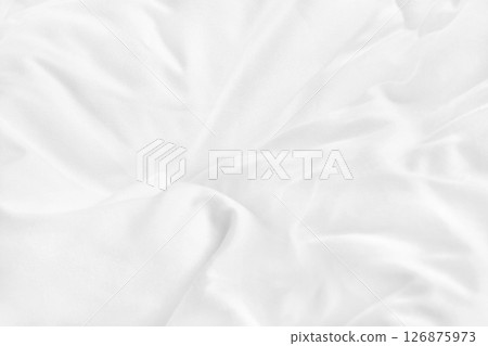 Close up top view of white bedding sheet and wrinkle messy blanket in bedroom after wake up in the morning. Close up top view of white bedding sheet and wrinkle messy blanket in bedroom after wake up in the morning. 126875973