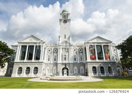 Building view of the oldest Victoria Theatre and Concert Hall in Empress Place, Singapore, with a complex of two buildings and a clock tower. 126876924