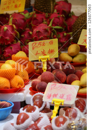 Fruits such as oranges sold at the open-air market. Most of them are imported. 126877063