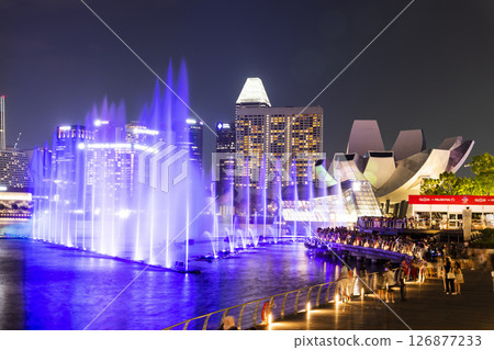 Beautiful view of the nightly music, water, and light show at Marina Bay Sands, here is an integrated resort fronting Marina Bay in Singapore. 126877233