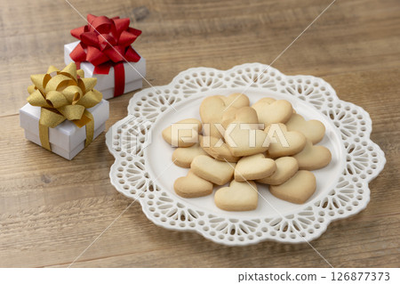 Valentine's table with heart-shaped cookies and gift boxes 126877373