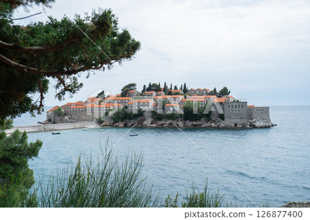 Sveti Stefan private island in Montenegro near Budva. Adriatic Sea Coast travel destination vacation holiday idea. Concept of getting away tourism experiences. Nature driven scenery 126877400