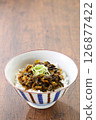 Takana bowl on the table, vertical composition, text space 126877422