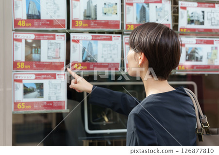 Woman looking for a property 126877810