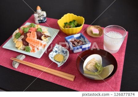 Food for Hinamatsuri. The standard Hinamatsuri dishes are chirashi sushi, clam soup, hishimochi rice cakes and sweet sake. Food for Hinamatsuri. The standard Hinamatsuri dishes are chirashi sushi, clam soup, hishimochi rice cakes and sweet sake. 126877874