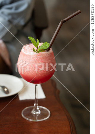 A chilled watermelon smoothie offers a refreshing escape from the heat. 126878159