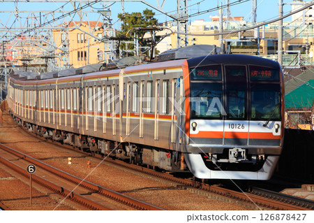 Tokyo Metro 10000 series train running smoothly on the Toyoko Line 126878427
