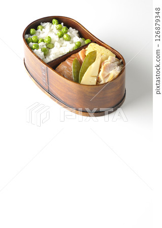 Bean and rice bento with plenty of side dishes photographed on a white background 126879348