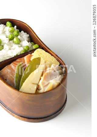 Bean and rice bento with plenty of side dishes photographed on a white background 126879355