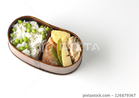 Bean and rice bento with plenty of side dishes photographed on a white background 126879367