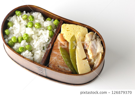 Bean and rice bento with plenty of side dishes photographed on a white background 126879370