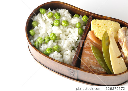 Bean and rice bento with plenty of side dishes photographed on a white background 126879372
